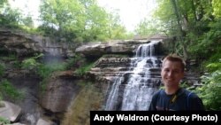 Mikah Meyer cools off by a waterfall in Cuyahoga Valley National Park, Ohio. 