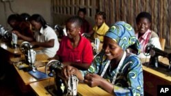 Women who have enrolled in international's programs in Rwanda and the Democratic Republic of the Congo are shown sewing.