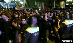 Police start to remove demonstrators outside the Turkish consulate in Rotterdam, Netherlands, March 11, 2017.
