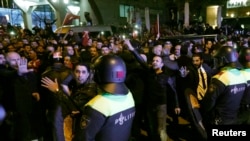 Police start to remove demonstrators outside the Turkish consulate in Rotterdam, Netherlands, March 11, 2017.