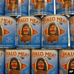 Cans of bison meat on the shelves at the Three Rivers Café and co-op in Indiana.