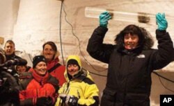 Project leader Dorthe Dahl Jensen holding the final piece of ice extracted from 2537.36 meters.
