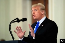 FILE - President Donald Trump speaks during a news conference in the East Room at the White House in Washington, Nov. 7, 2018.