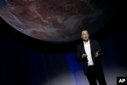FILE - SpaceX founder Elon Musk speaks during the 67th International Astronautical Congress in Guadalajara, Mexico, Sept. 27, 2016.