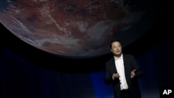 In this file photo, SpaceX founder and Tesla CEO Elon Musk speaks during the 67th International Astronautical Congress in Guadalajara, Mexico, Sept. 27, 2016.