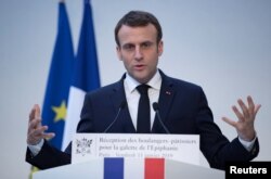 FILE - French President Emmanuel Macron delivers a speech during a traditional epiphany cake ceremony at the Elysee palace in Paris, France, Jan. 11, 2019.