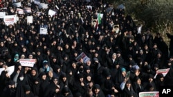 Iranian protesters chant slogans at a rally in Tehran, Iran, Dec. 30, 2017. Iranian hard-liners rallied Saturday to support the country's supreme leader and clerically overseen government as spontaneous protests sparked by anger over the country's ailing economy.