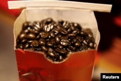 FILE - Coffee beans are seen in a bag at a branch of Nairobi Java House in Nairobi.