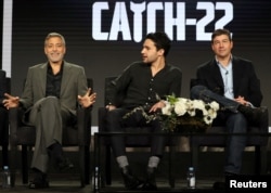 Actor, executive producer, and director George Clooney (L-R), actor Christopher Abbott, and actor Kyle Chandler speak on a panel for the Hulu series "Catch-22," during the Television Critics Association (TCA) Winter Press Tour in Pasadena, California, Feb. 11, 2019.