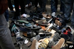 FILE - Shoes lie on the ground after a stampede in Bishoftu, Ethiopia, Oct. 2, 2016.