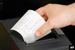 A volunteer pulls a client's food order to be filled, at the Jewish Federation of Greater Philadelphia Digital Choice Food Program in Philadelphia, July 1, 2015.