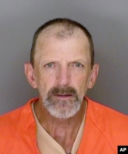 This undated booking photo provided by the Santa Cruz County, Calif., Sheriff's Office shows Marlon Coy, who is suspected of starting a wildfire that destroyed two homes in Northern California and is facing multiple arson charges.