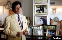 Ahmed Gaddaf al-Dam, cousin of Libya's former president Moammar Gadhafi, talks during an interview with Reuters at his apartment in Cairo, Oct. 9, 2014.