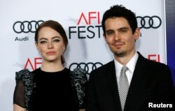 Director Damien Chazelle and cast member Emma Stone pose at the premiere of "La La Land" during AFI FEST in Hollywood, Calif., Nov. 15, 2016.