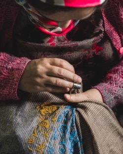 An artisan weaves the Pashmina fabric in Srinagar. (Me&K photo)