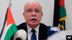 Palestinian Foreign Minister Riad Malki speaks during a press conference at the International Criminal Court, May 22, 2018.