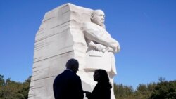 FILE - President Joe Biden and Vice President Kamala Harris stand together at the Martin Luther King, Jr. Memorial as they arrive to attend an event marking the 10th anniversary of the dedication of memorial in Washington, Oct. 21, 2021.