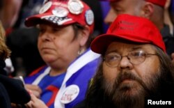 Supporters look on as President Donald Trump holds a campaign rally at Mayo Civic Center in Rochester, Minn., Oct. 4, 2018.