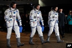 From left: NASA astronaut Jeff Williams, Russian cosmonauts Alexei Ovchinin, and Oleg Skripochka of Roscosmos, members of the main crew of the expedition to the International Space Station (ISS), March 19, 2016.