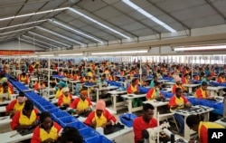 FILE - Ethiopian factory workers make shoes at Chinese company Huajian's plant in Addis Ababa, Ethiopia, Jan. 5, 2017.