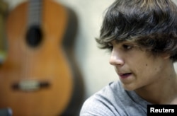 Pedro Gonzalez attends a guitar class at the private music school Escuela de Musica Creativa in central Madrid, Spain, Nov. 6, 2015.