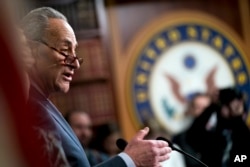 FILE - Senate Minority Leader Chuck Schumer of New York speaks at a news conference on Capitol Hill in Washington, Dec. 21, 2017.