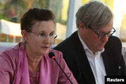 FILE - Renata Lok-Dessallien, left, the U.N. Resident and Humanitarian Coordinator in Myanmar, and British ambassador to Myanmar Andrew Patrick attend a news conference after a trip to the Maungdaw area in northern Rakhine state in Myanmar, Nov. 3, 2016.