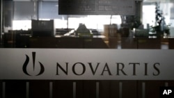 A logo of Swiss pharmaceutical company Novartis is seen at the Novartis Korea office in Seoul, South Korea, Saturday, Aug. 13, 2016. (AP Photo/Ahn Young-joon)