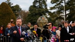 Louay Safi, spokesperson for the Syrian National Coalition, addresses media after meeting at Geneva Conference on Syria, UN European headquarters, Geneva, Feb. 15, 2014.