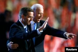 Attorney General Beau Biden of Delaware, left, and Vice Presidential candidate Senator Joe Biden (D-Del.) on stage at the 2008 Democratic National Convention in Denver, Aug. 27, 2008.