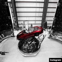 "Starman" sits behind the wheel of a Tesla roadster in this photo posted to the Instagram account of Elon Musk, head of the Tesla car company and founder of SpaceX.