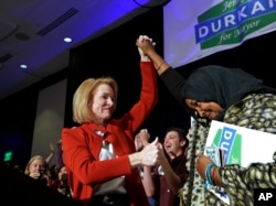 Jenny Durkan gives a thumbs-up to a supporter while taking the stage at an election night party in Seattle, Nov. 7, 2017. Durkan became the first lesbian to be elected as the city's mayor.