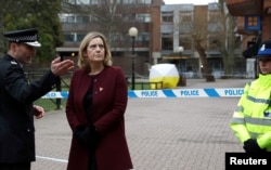 Britain's Home Secretary Amber Rudd visits the scene where Sergei Skripal and his daughter Yulia were found after having been poisoned by a nerve agent in Salisbury, Britain, March 9, 2018.
