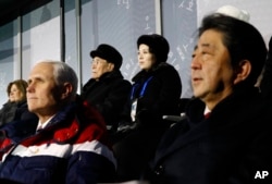 Kim Yong Nam, top left, president of the Presidium of North Korean Parliament, and Kim Yo Jong, sister of North Korean leader Kim Jong Un, top right, sit behind U.S. Vice President Mike Pence, bottom left, and Japanese Prime Minister Shinzo Abe