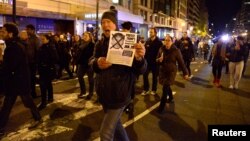 Demonstrators march against President-elect Donald Trump's election, in downtown Washington, after leaving Lafayette Park, near the White House, in Washington, Nov. 12, 2016.