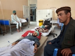 Wounded men receive treatment in a hospital after a Taliban attack in the Nahrin district of Baghlan province north of Kabul, Afghanistan, June 29, 2019.