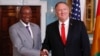 Secretary of State Mike Pompeo, right, shakes hands with Guinean President Alpha Conde at the State Department in Washington, Sept. 13, 2019.