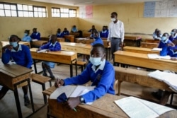 Schoolchildren attend class at the Olympic Primary School in Kibera, one of the capital Nairobi's poorest areas, in Kenya, Oct. 12, 2020.