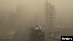 FILE - A general view shows the skyscrapers Beijing, China, shrouded in smog, March 15, 2021. 
