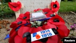 A wreath of poppies in memory of fallen soldiers is seen at Ramparts Cemetery in Ypres, Belgium, home of one of WWI's deadliest battles, June 25, 2014.