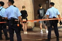 Police detain people near Victoria Park in the Causeway Bay district of Hong Kong, June 4, 2021.