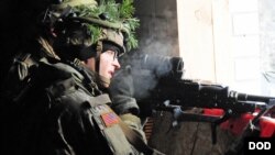 A U.S. paratrooper participates in a NATO exercise at an urban training center in Pabrade, Lithuania, Nov. 29, 2016.
