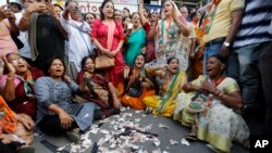 Supporters of India's main opposition Congress party protest on the first anniversary of the Nov. 8 demonetization announcement, in Ahmadabad, India, Wednesday, Nov. 8, 2017. (AP Photo/Ajit Solanki)