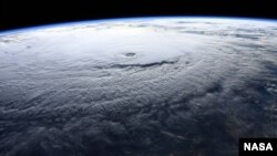 NASA astronaut Ricky Arnold photographs this massive Hurricane Lane near Hawaii in the Pacific Ocean during a flyover from the International Space Station, Aug. 22, 2018.