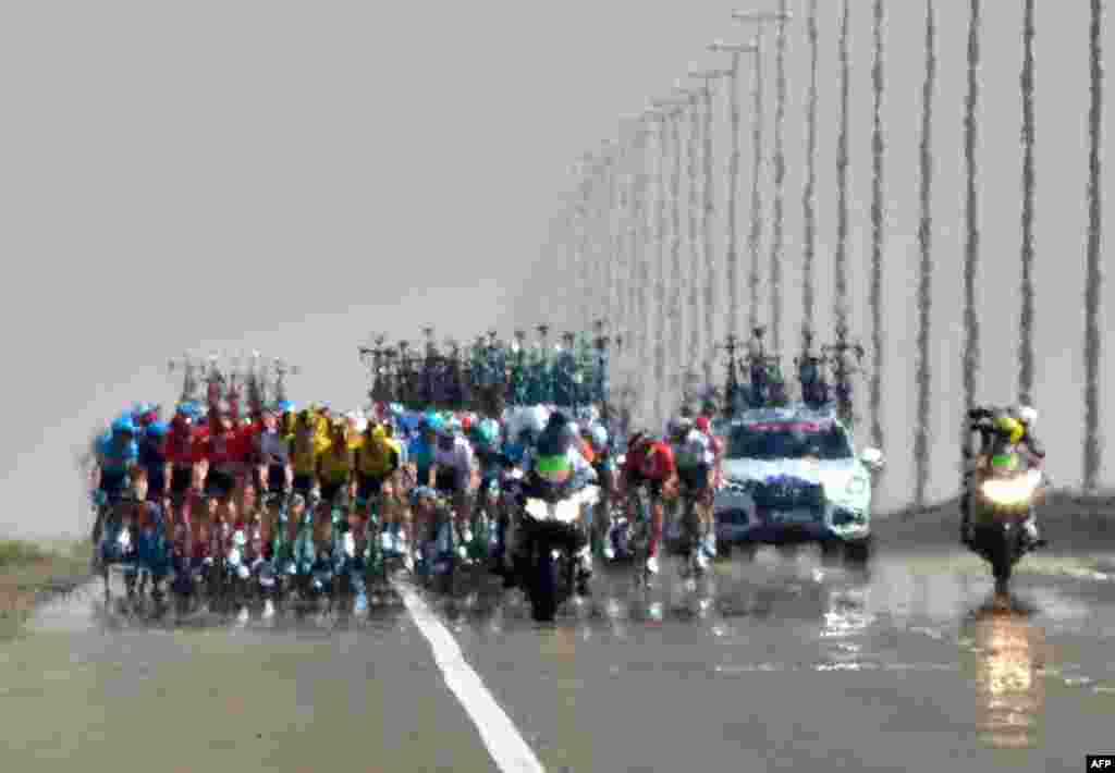 Cyclists compete during the third stage of the UAE cycling tour in al-Ain.