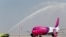 FILE - A Wizz Air jet lands at Al Maktoum International Airport in Dubai, United Arab Emirates, Oct. 27, 2013. 