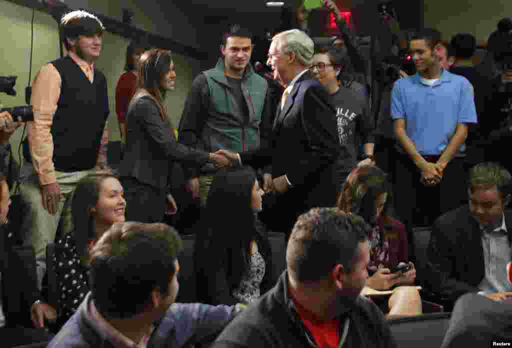 U.S. Senate Minority Leader Mitch McConnell talks with University of Louisville students after a news conference on the day after he was re-elected to a sixth term to the U.S. Senate, University of Louisville, Louisville, Kentucky, Nov. 5, 2014. 
