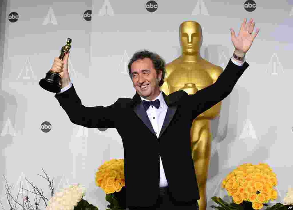 Paolo Sorrentino poses in the press room with the award for best foreign language film of the year for "The Great Beauty" during the Oscars.