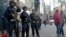 FILE - Officers from the New York Police Department's anti-terror unit patrol Times Square, Nov. 4, 2016.