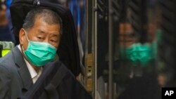 FILE - In this Feb. 1, 2021, photo, democracy advocate Jimmy Lai leaves Hong Kong's Court of Final Appeal where the government is arguing against allowing him bail in Hong Kong. 